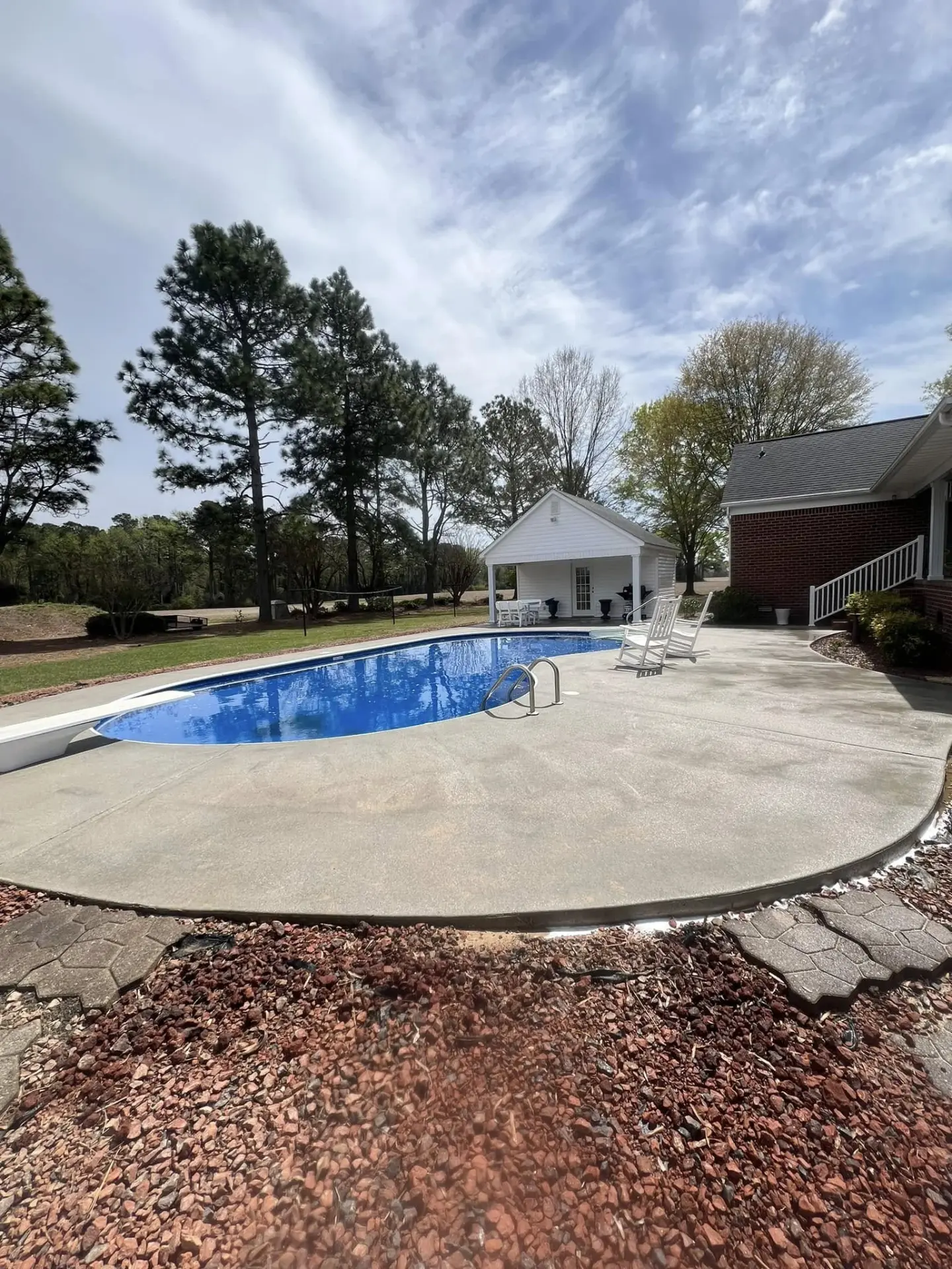Pool Deck Cleaning — Concrete pool surround